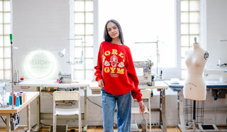 model wearing vintage red world gym sweatshirt